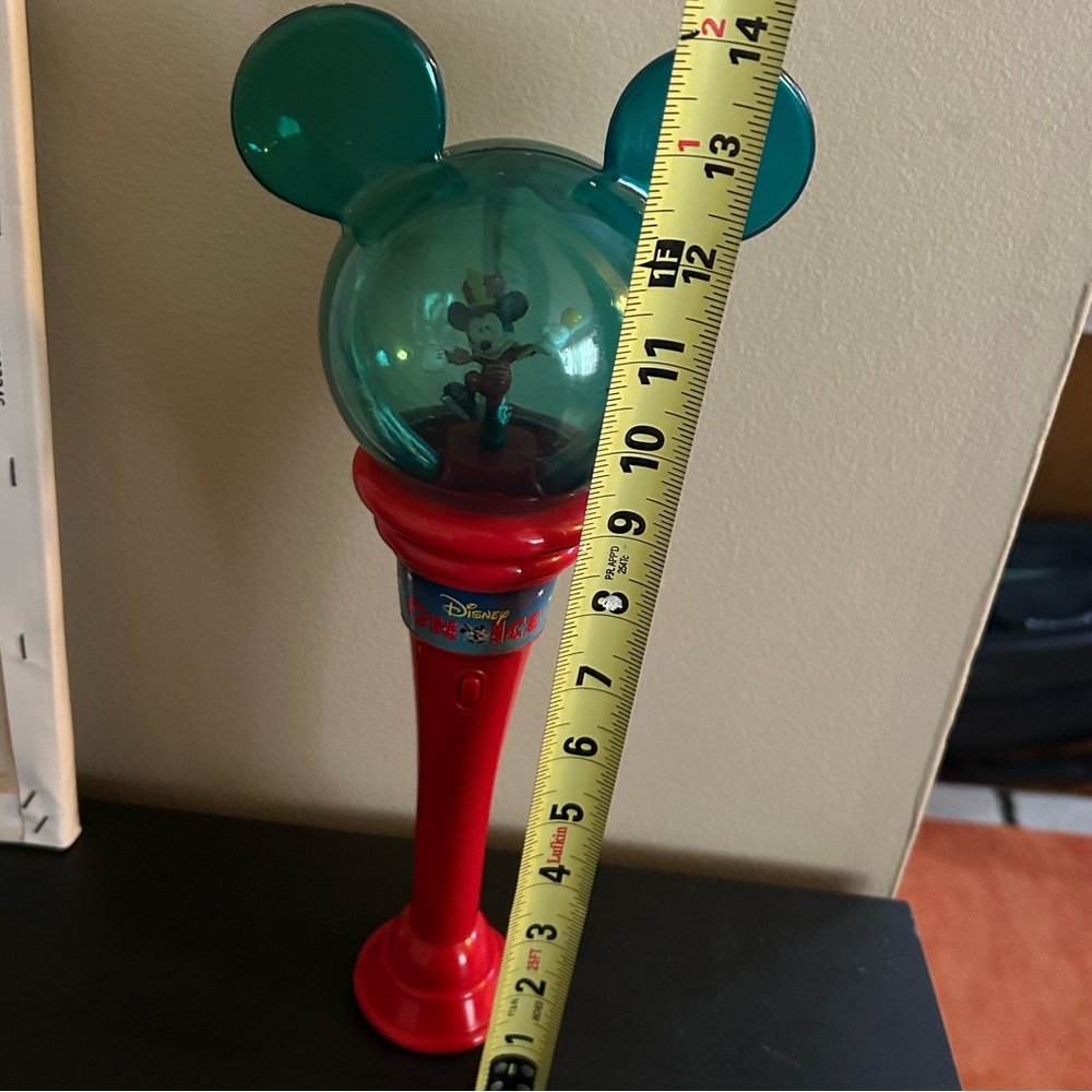 Vintage Disney on ice light up musical wand. In working condition.